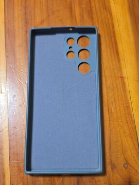 Blue Protective Phone Case - Multi-Camera Cutouts. Scuffs on the 4 corners.